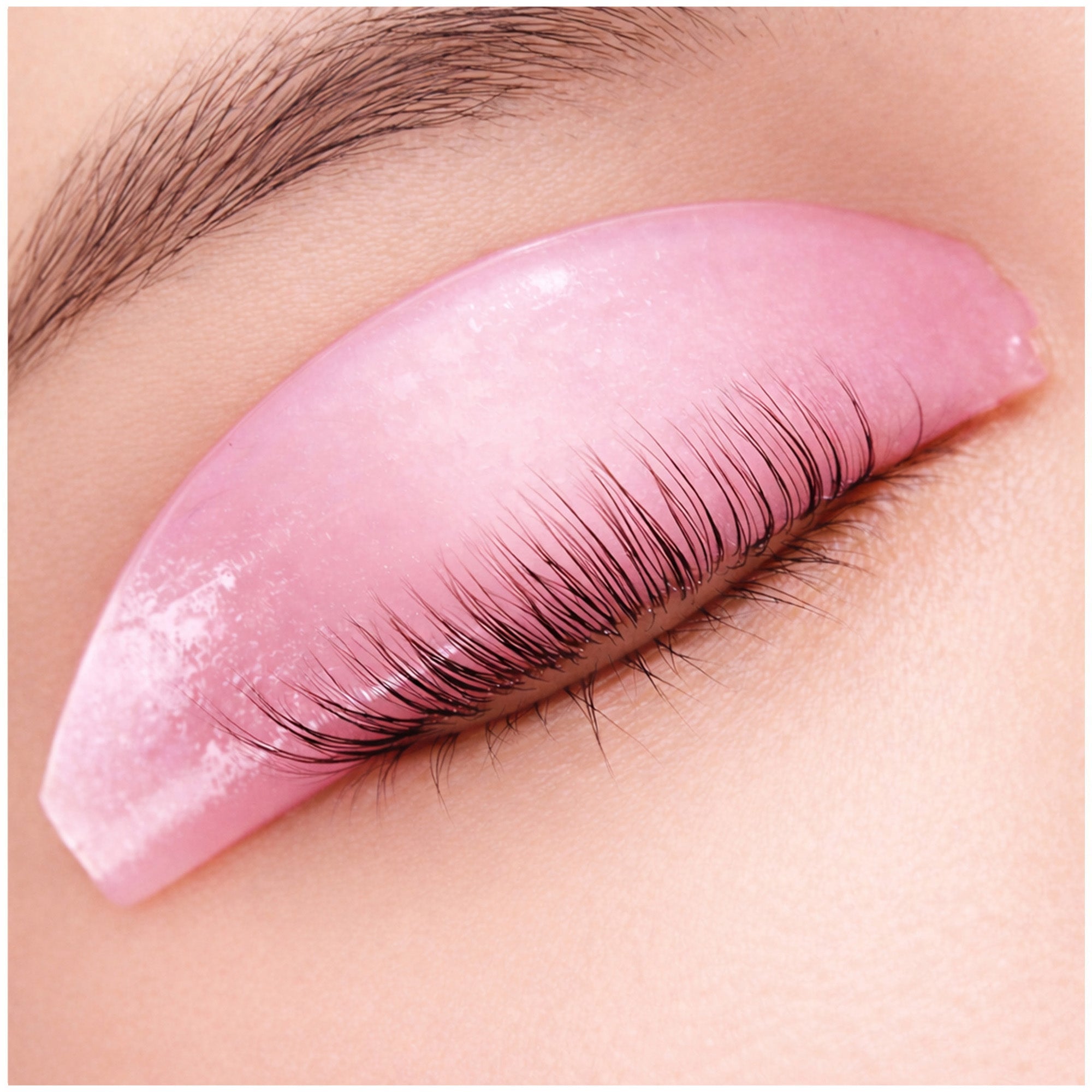 Korean lash lift pad applied on eyelid showing natural lash placement during lash lift treatment