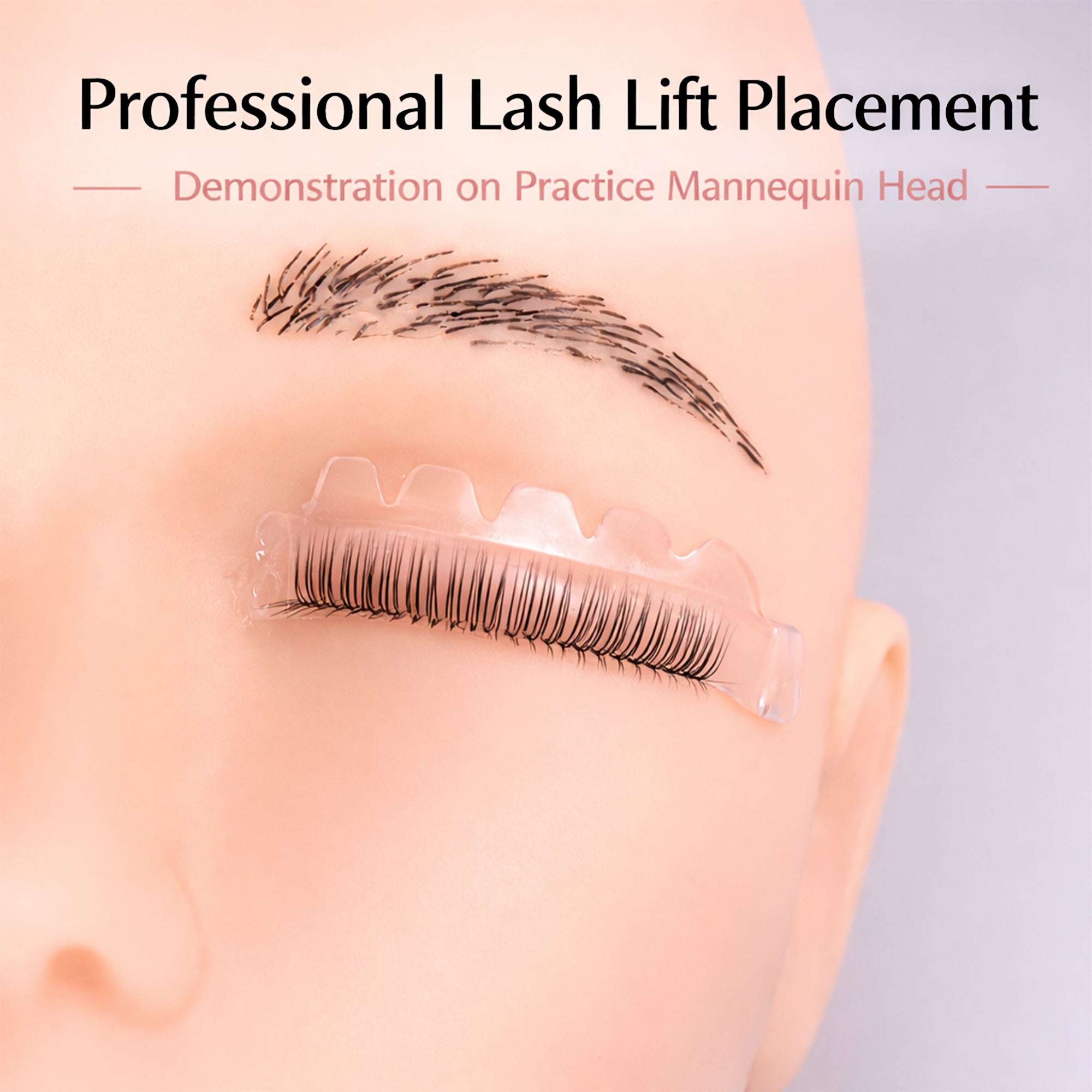 Natural lash placement demonstration on a translucent pink YSEN’S lash lift shield and practice head