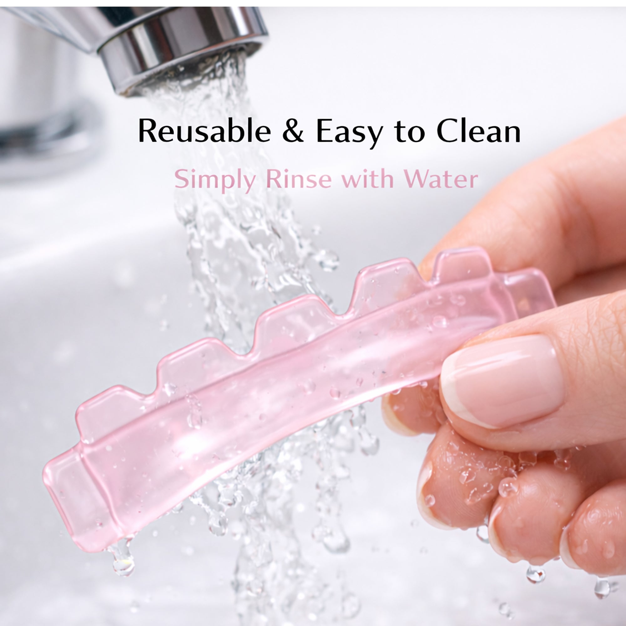 Translucent pink YSEN’S reusable silicone lash lift shield being rinsed during cleaning